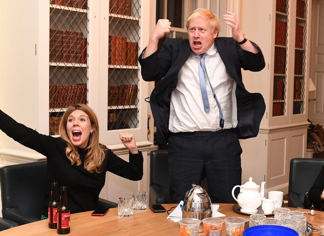Johnson and his partner, Carrie Symonds, react to election results from his study at No. 10 Downing Street.