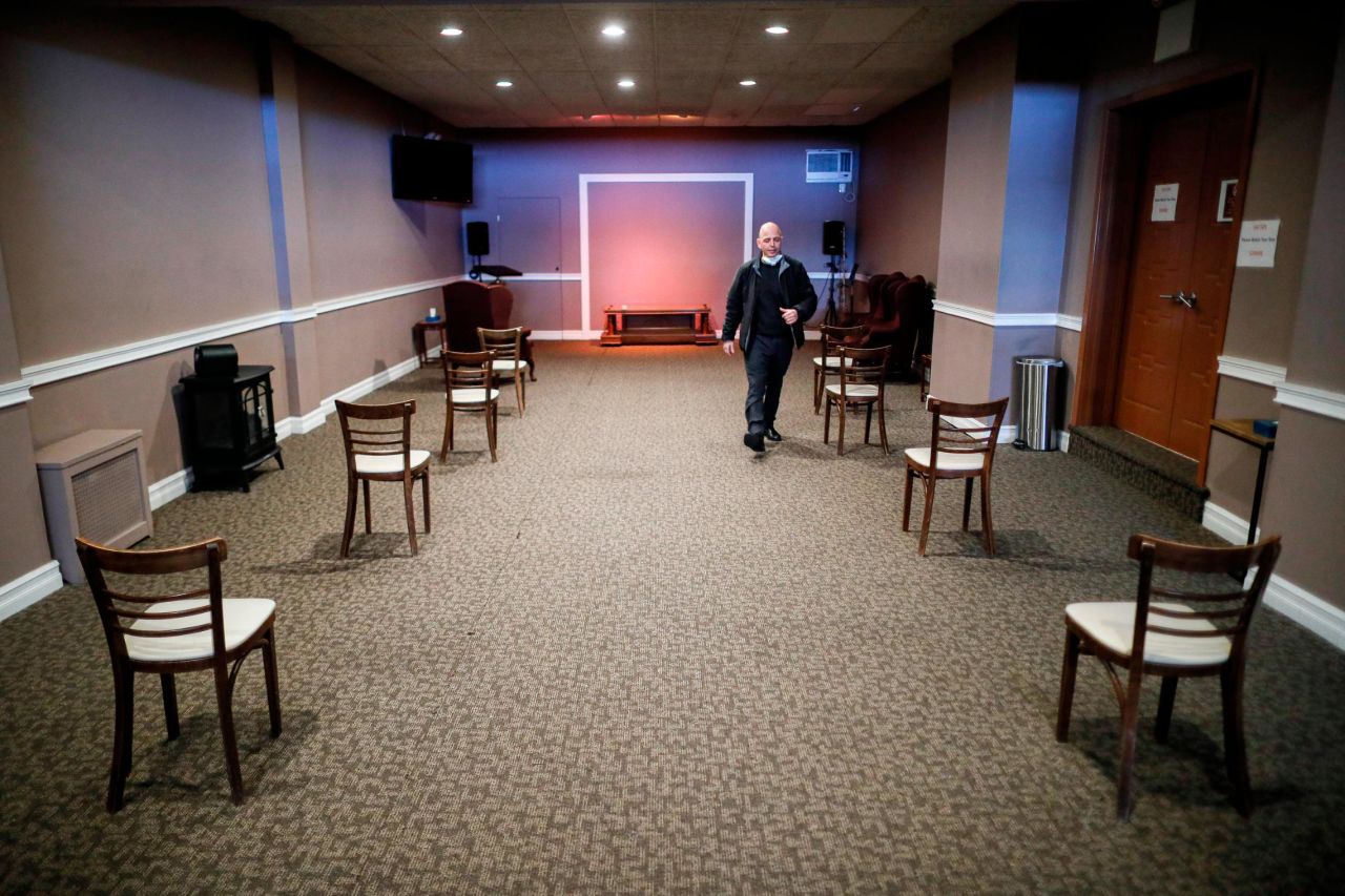 Marmo walks through a viewing room set up to respect social distancing on Thursday, April 2.