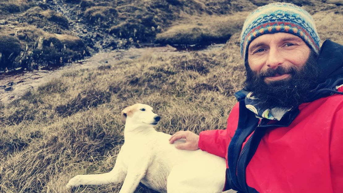 Christian Lewis and his dog Jet, stranded on Hildasay island, off the Shetlands.