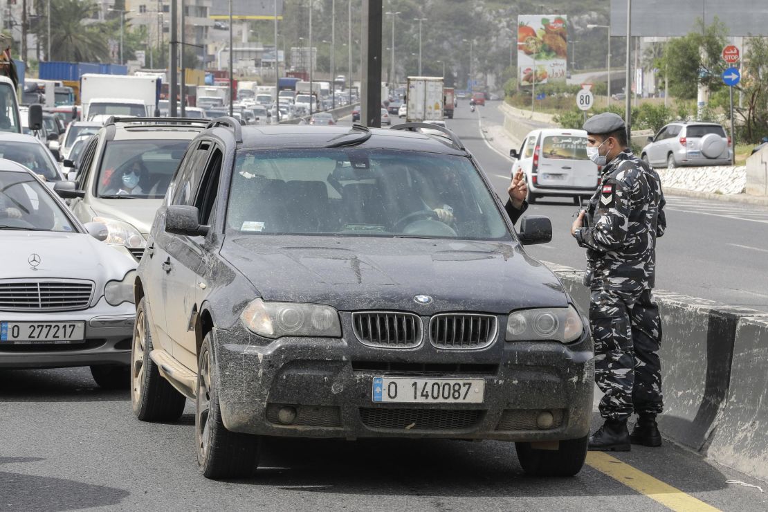 Lebanese security forces stop cars at a highway checkpoint north of Beirut on April 6, as authorities implemented further measures restricting the movement of vehicles.