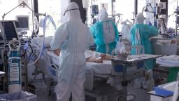 Healthcare workers wearing protective suits attend to COVID-19 coronavirus patients at the Intensive Unit Care (ICU) of the Vall d'Hebron Hospital in Barcelona on April 6, 2020. - Spain declared a fourth consecutive drop in the number of coronavirus-related deaths with 637 over the past 24 hours, the lowest number in nearly two weeks. (Photo by PAU BARRENA / AFP) (Photo by PAU BARRENA/AFP via Getty Images)