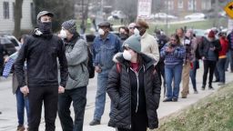 Voters line up observing social distancing at Riverside High School for Wisconsin's primary election Tuesday April 7, 2020, in Milwaukee. 