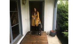 Sassy Outwater-Wright leaves her home with her guide dog.