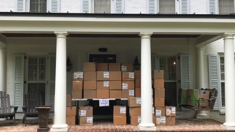 Masks that volunteers were able to repair are packed up on Stephanie Lepone's porch.