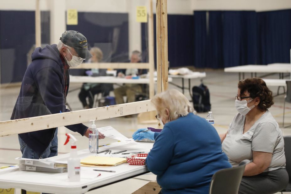 A voter checks in to cast a ballot in Kenosha, Wisconsin, on April 7, 2020. The state was going through with <a href="index.php?page=&url=https%3A%2F%2Fwww.cnn.com%2F2020%2F04%2F07%2Fpolitics%2Fwisconsin-primary-coronavirus%2Findex.html" target="_blank">its presidential primary</a> despite the pandemic.