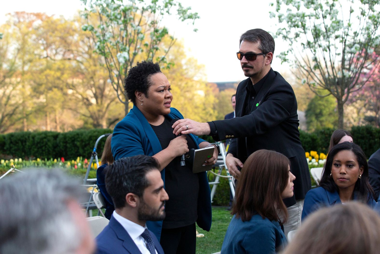 A White House aide attempts to take the microphone out of the hands of PBS reporter Yamiche Alcindor during a briefing at the White House on March 29. <a href="index.php?page=&url=https%3A%2F%2Ftwitter.com%2FYamiche%2Fstatus%2F1244409447230947328" target="_blank" target="_blank">Alcindor asked Trump</a> about an appearance he made on Fox News on March 26, where he questioned whether some governors actually needed the amount of aid they were requesting to combat the coronavirus: "I have a feeling that a lot of the numbers that are being said in some areas are just bigger than they are going to be," <a href="index.php?page=&url=https%3A%2F%2Fyoutu.be%2FA6Jd-e1vUoA" target="_blank" target="_blank">Trump told Sean Hannity on Fox News.</a> "I don't believe you need 40,000 or 30,000 ventilators." In response to Alcindor's question about how the views Trump expressed in his Fox News interview will impact how he fulfills orders for ventilators or for masks, Trump said: "Why don't you act in a little more positive — it's always trying to get ya. Get ya. Get ya. And you know what? That's why nobody trusts the media anymore. ... Be nice. Don't be threatening. Don't be threatening. Be nice."