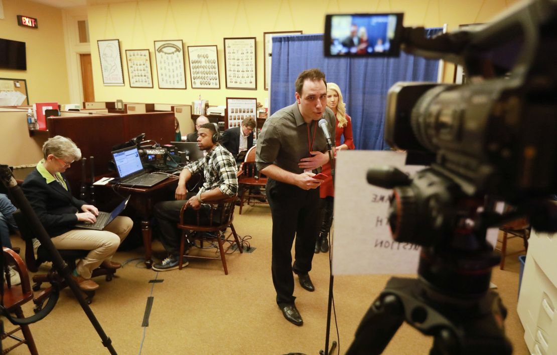 Columbus Dispatch reporter Max Filby asks a question via video feed to Ohio Gov. Mike DeWine at a coronavirus news conference on March 17, 2020 at the Ohio Statehouse. (Photo by Doral Chenoweth/Columbus Dispatch)