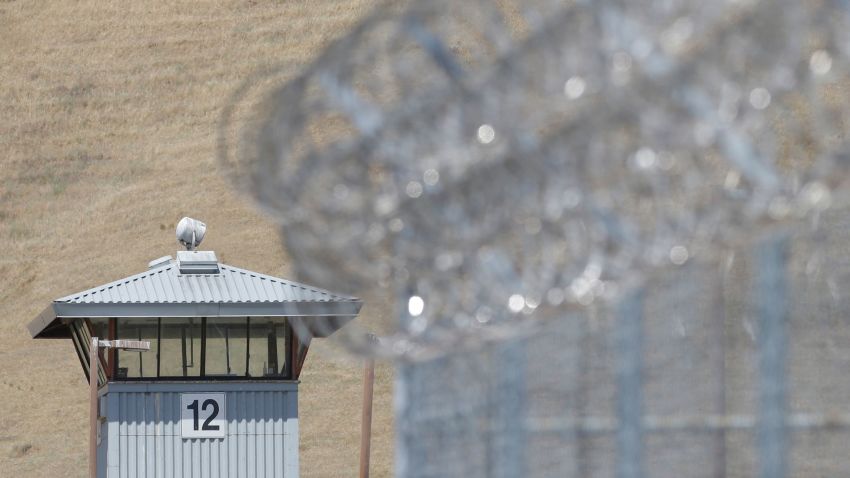 In this photo taken Wednesday May 20, 2015,  a guard tower and razor wire are seen at California State Prison, Solano in Vacaville, Calif.  Authorities are investigating the murder of Nicholas Anthony Rodriguez a the prison in May. An autopsy report reveals that Rodriguez' body was cut apart and most of his major body organs removed, prompting an investigation of whether a riot by dozens of prisoners was used to cover up the homicide.(AP Photo/Rich Pedroncelli)