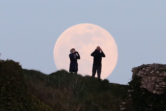 The pink supermoon rises over the Rock of Dunamase in Laois, Ireland. 