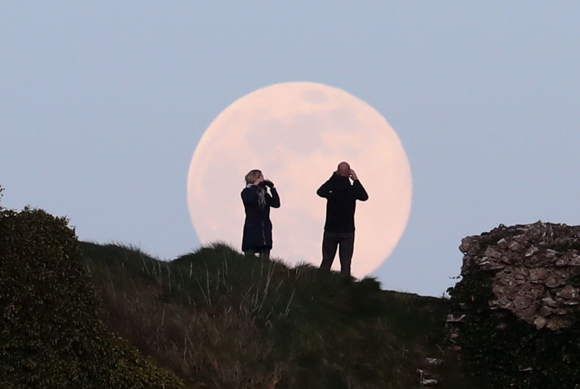 The pink supermoon rises over the Rock of Dunamase in Laois, Ireland. 