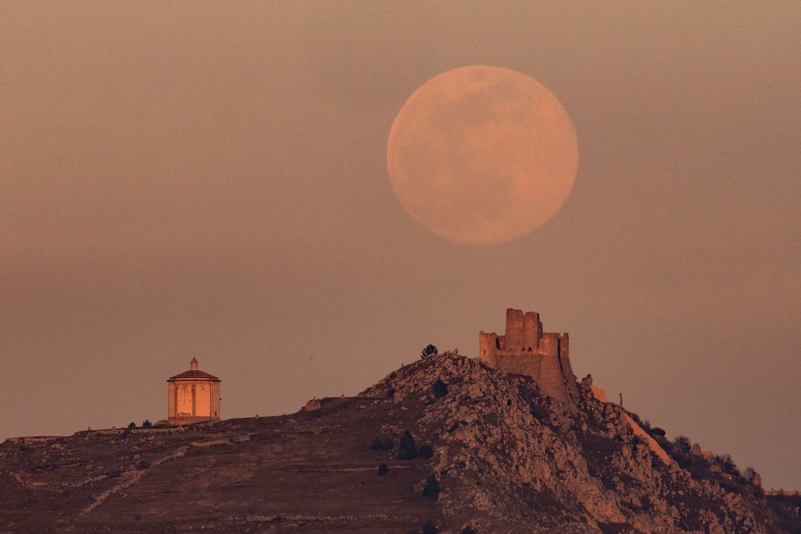 The supermoon rises behind Rocca Calascio castle in Italy.