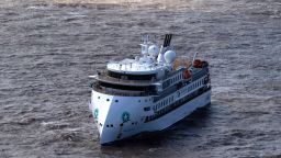 Aerial view of Australian cruise ship Greg Mortimer off the port of Montevideo on April 7, 2020. - Australian and New Zealand passengers on board a cruise ship off the South American coast will be the first flown home in a series of rescue flights as coronavirus on the ship rose sharply Tuesday, according to the Greg Mortimer's operator. Confirmed COVID-19 cases on the ship -  currently anchored in the Rio de la Plata near Uruguay - jumped from 81 to 128 on Tuesday with a medical flight for the Australians onboard expected to begin Thursday. (Photo by Pablo PORCIUNCULA / AFP) (Photo by PABLO PORCIUNCULA/AFP via Getty Images)