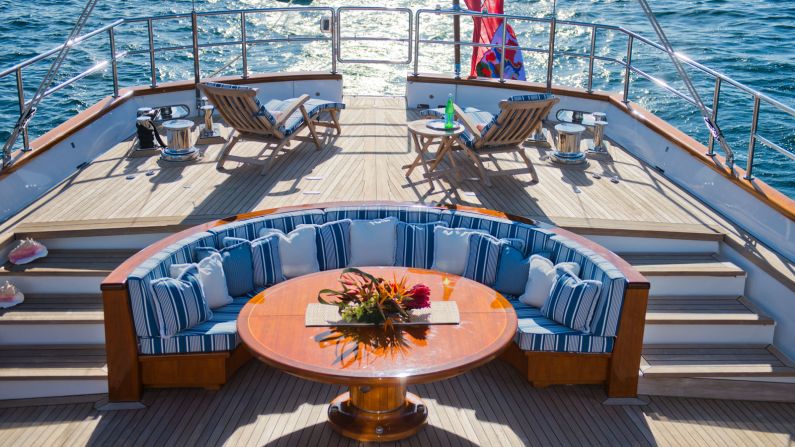 <strong>Stylish design:</strong> The top deck is kitted out with a L-shaped lounge and sofa, offering panoramic views while at sail.