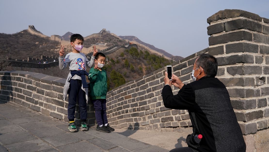 Children wear protective masks as they visit the Badaling section of China's Great Wall on March 24.  