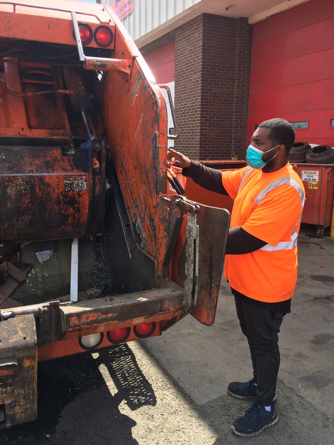 Tenleytown Trash workers are wearing masks made by the Washington National Opera's costume department.
