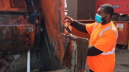 Tenleytown Trash & Recycling workers are wearing masks made by the Washington National Opera's costume department.