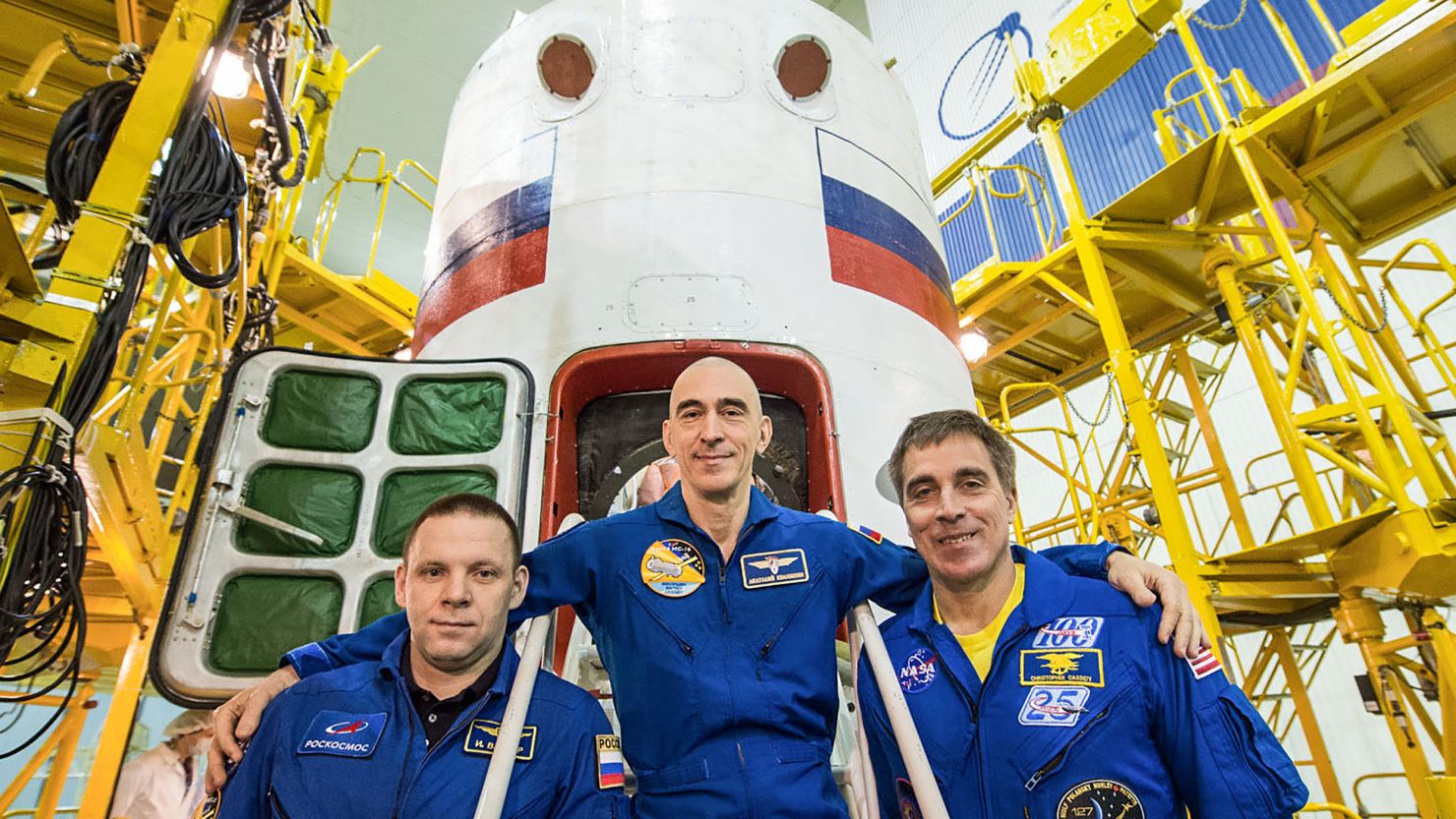 At the Baikonur Cosmodrome in Kazakhstan, Expedition 63 crewmembers Ivan Vagner (left) and Anatoly Ivanishin (center) of Roscosmos and Chris Cassidy (right) of NASA pose for pictures on April 3 in front of their Soyuz spacecraft as part of their pre-launch activities. 