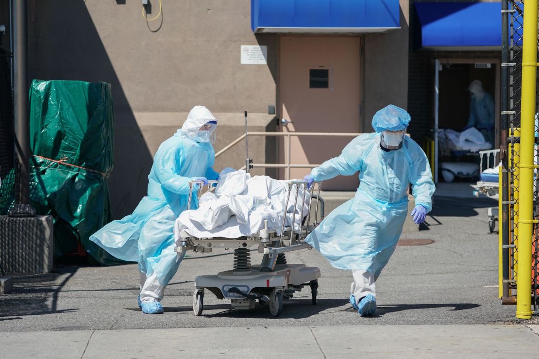 Bodies are moved to a refrigeration truck serving as a temporary morgue at Wyckoff Hospital in Brooklyn on April 6, 2020 in New York. 