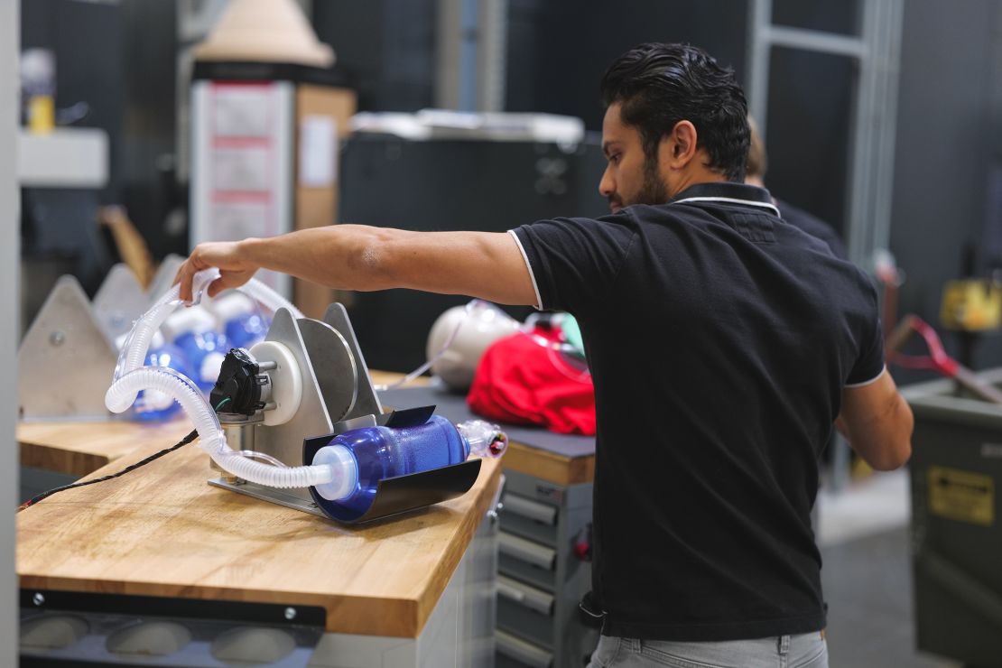 Engineer Vishal Doshi runs tests on an early prototype of a bridge ventilator in Virgin Orbit's Long Beach, California lab. 