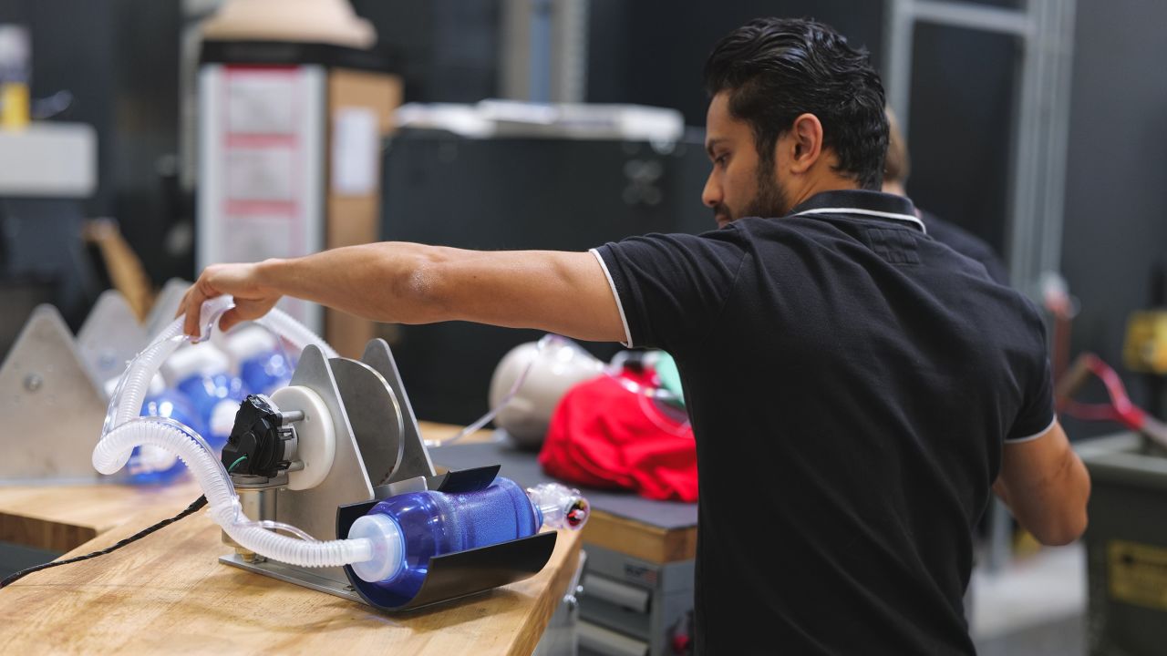 Engineer Vishal Doshi runs tests on an early prototype of a bridge ventilator in Virgin Orbit's Long Beach, California lab.
