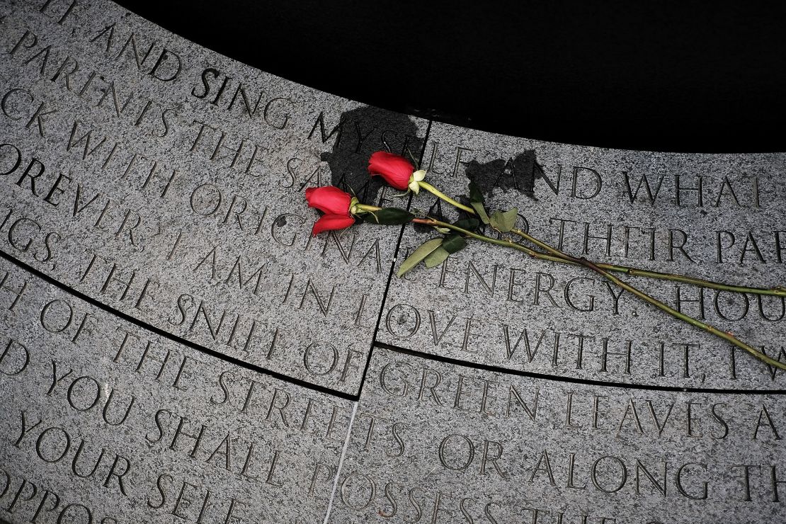 Flowers lay at a memorial to honor AIDS victims, dedicated on World AIDS Day on December 1, 2016 in New York City.