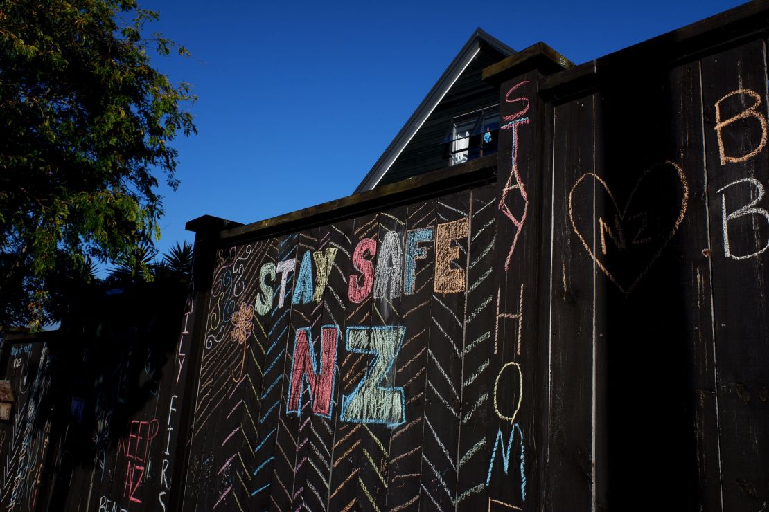 A house fence chalked up with messages relating to the Covid-19 lockdown on April 3, 2020 in Auckland, New Zealand. 