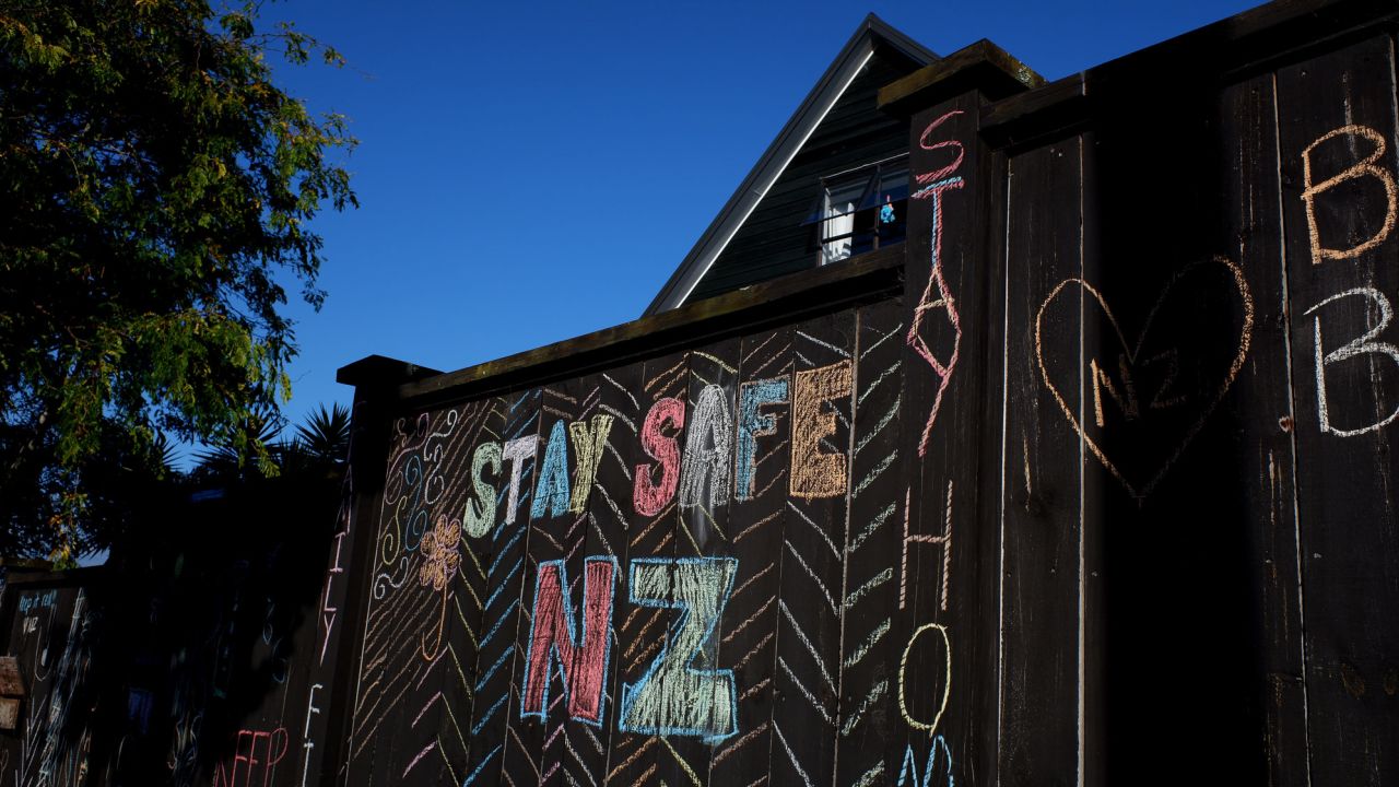 A house fence has been chalked up with messages relating to the Covid-19 lockdown on April 3, 2020 in Auckland, New Zealand. 