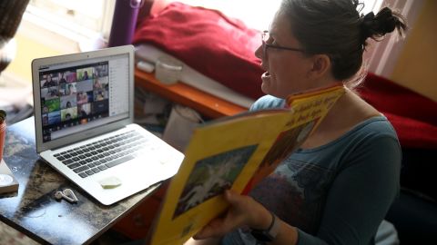 A teacher conducts an online class from her living room on March 20, 2020 in San Francisco, California. With schools closed across the United States due to the COVID19 pandemic, teachers are holding some classes for students online. 