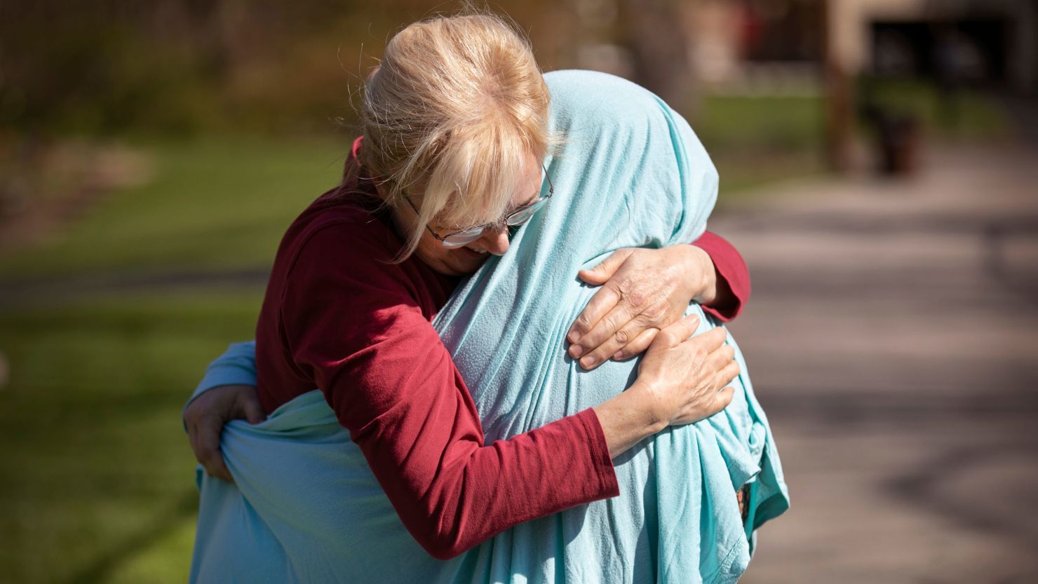 Cheryl Norton hugs her daughter, Kelsey Kerr, 28, an ICU nurse at Christ Hospital.