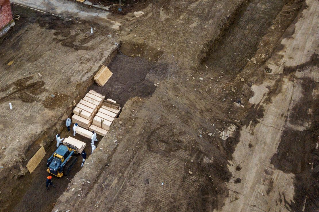 Drone images show bodies being buried on New York's Hart Island on Thursday. 