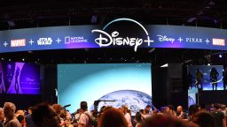 Attendees visit the Disney+ streaming service booth at the D23 Expo, billed as the "largest Disney fan event in the world," August 23, 2019 at the Anaheim Convention Center in Anaheim, California. - Disney Plus will launch on November 12 and will compete with out streaming services such as Netflix, Amazon, HBO Now and soon Apple TV Plus. (Photo by Robyn Beck / AFP)        (Photo credit should read ROBYN BECK/AFP via Getty Images)