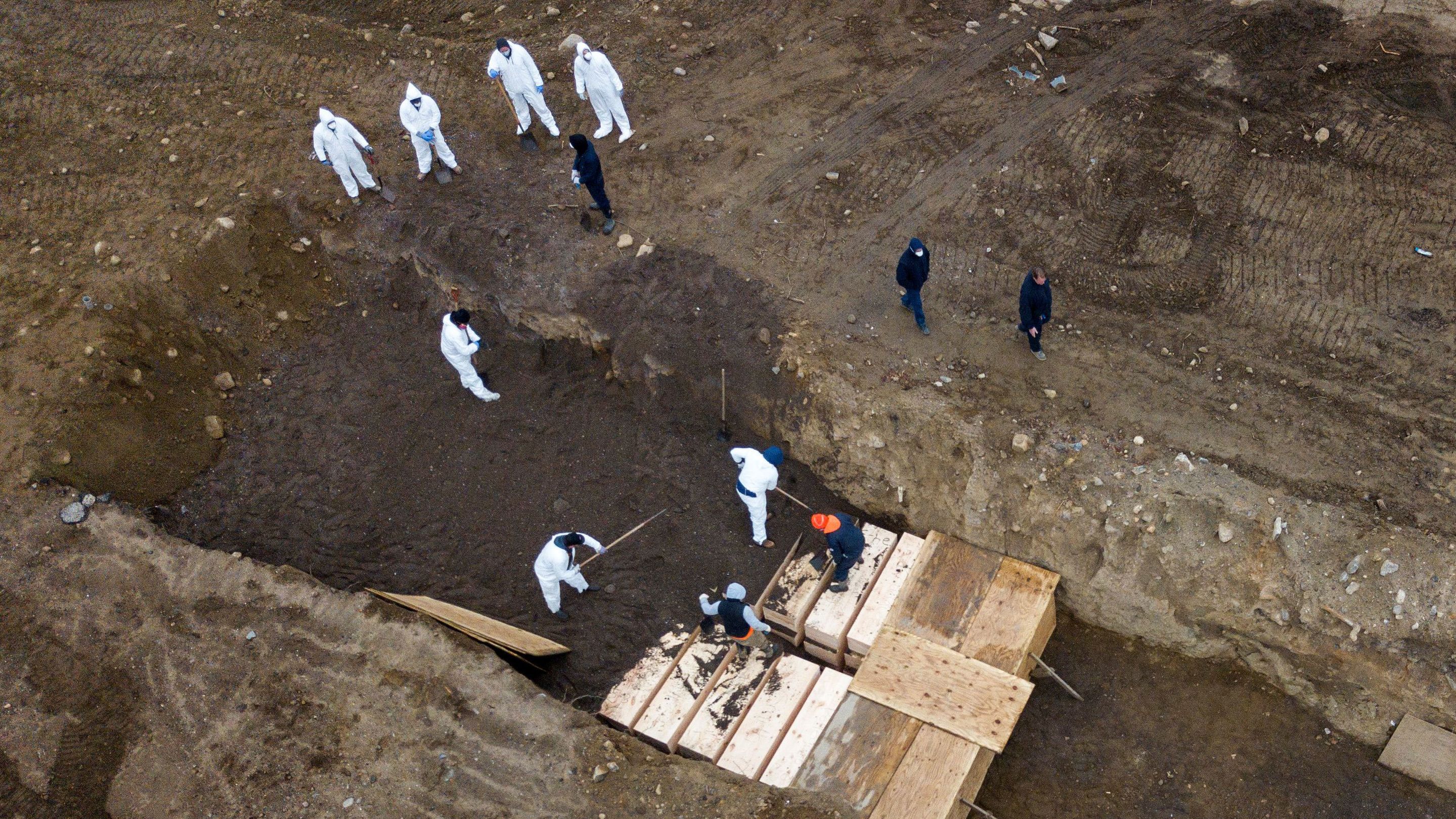 Drone pictures show bodies being buried on New York's Hart Island.
