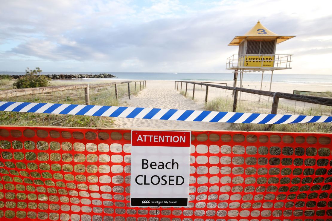 The beaches are closed and travelers and international arrivals into Australia are being sent to mandatory quarantine in hotels for 14 days.