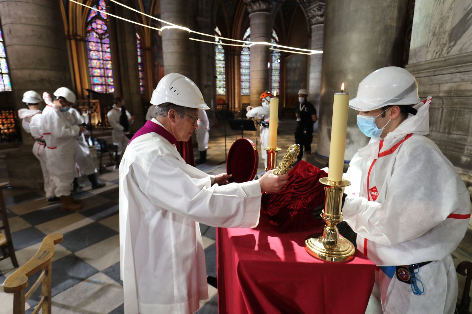 Notre Dame cathedral rector Patrick Chauvet repositions the Crown of Thorns, a relic of the passion of Christ, after a meditation ceremony to celebrate Good Friday in a secured part of Notre Dame on April 10.