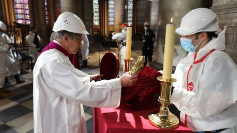 Notre Dame cathedral rector Patrick Chauvet repositions the Crown of Thorns, a relic of the passion of Christ, after a meditation ceremony to celebrate Good Friday in a secured part of Notre Dame on April 10.