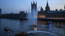 LONDON, ENGLAND - APRIL 09: Emergency services boats are seen spraying water to applause NHS staff by the Houses of Parliament and Westminster Bridge on April 09, 2020 in London, England. Following the success of  the "Clap for Our Carers" campaign, members of the public are being encouraged to applaud NHS staff and other key workers from their homes at 8pm every Thursday. The Coronavirus (COVID-19) pandemic has infected over 1.5 million people across the world, claiming over 7,978 lives in the U.K. (Photo by Peter Summers/Getty Images)