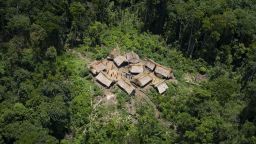 Aerial view of Irotatheri community, in Amazonas state, southern Venezuela, 19 km away from the border with Brazil, on September 7, 2012. The Venezuelan government on Friday agreed to lead a delegation of national and international media to Irotatheri after a slaughter of 80 Yanomami natives was reported. Venezuelan militarymen detected evidence of illegal mining in the south of the country, where Yanomami natives would have presumably been massacred by Brazilian illegal gold prospectors.  AFP PHOTO/Leo RAMIREZ        (Photo credit should read LEO RAMIREZ/AFP/GettyImages)