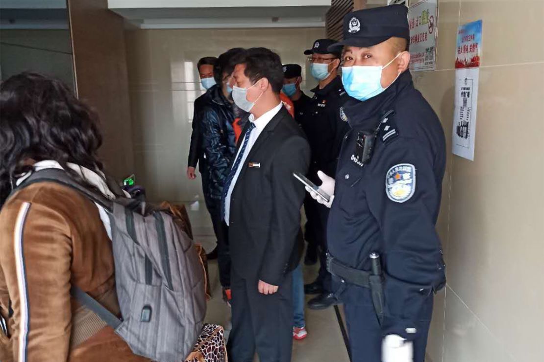 Police come to the house of an African resident in Beijing.