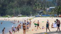 International tourists, predominantly Russian nationals, enjoy the beach despite concerns over the spread of the COVID-19 coronavirus and restrictions for travellers at a resort in Phuket on March 20, 2020. (Photo by Mladen ANTONOV / AFP) (Photo by MLADEN ANTONOV/AFP via Getty Images)