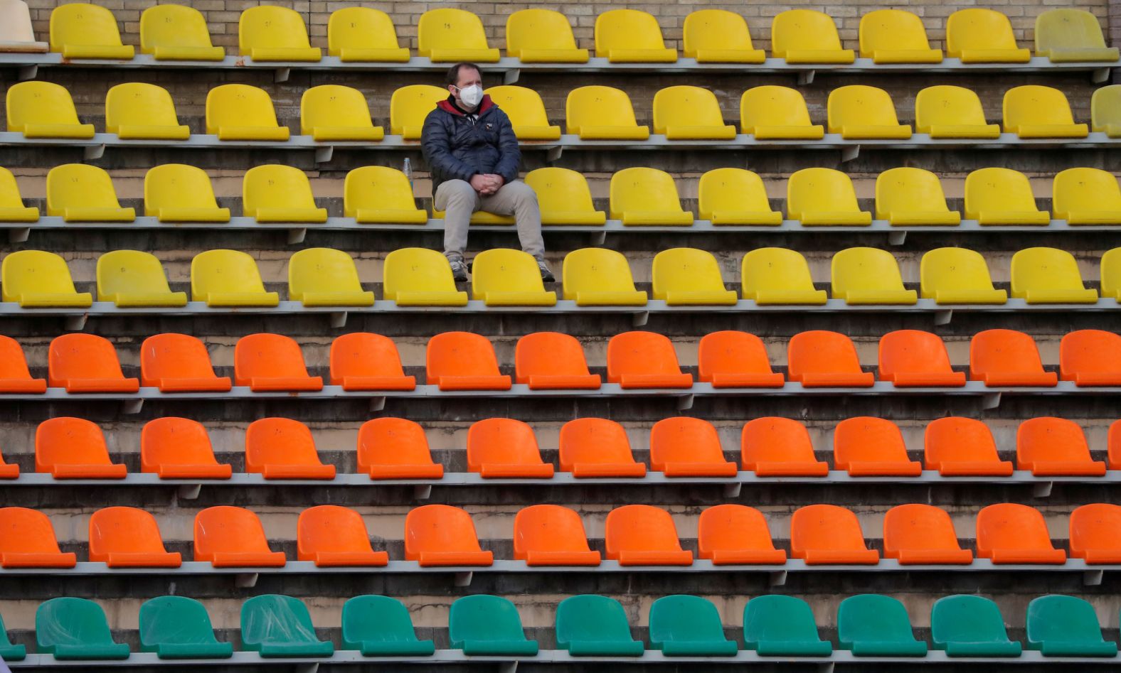 A fan watches a professional soccer game in Grodno, Belarus, on April 10. <a href="https://www.cnn.com/videos/sports/2020/03/30/belarus-keeps-sports-going-football-hockey-coronavirus-spt-intl-lon-orig.cnn" target="_blank">The Belarusian Premier League</a> was one of the few sports organizations that didn't shut down.