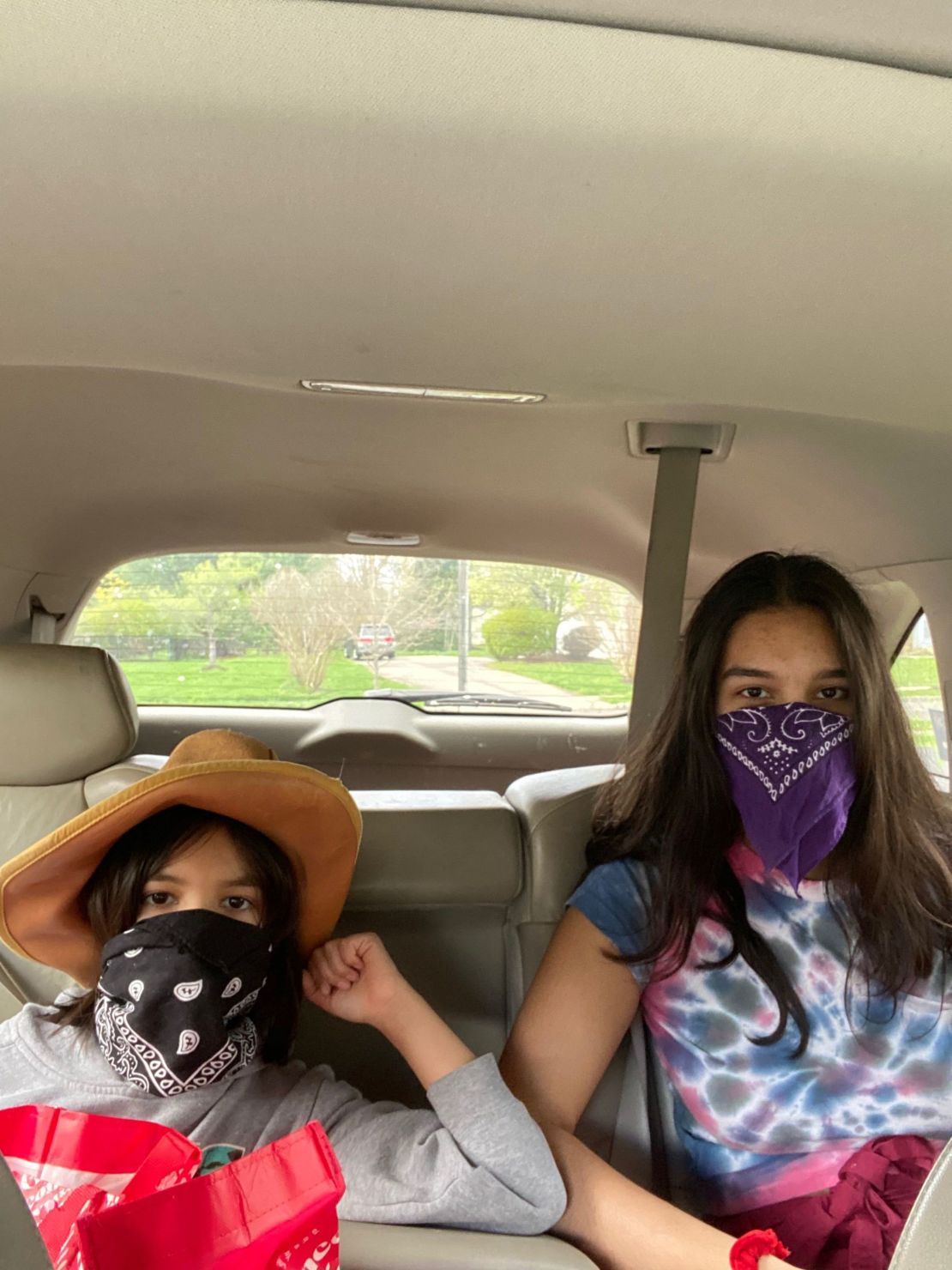 My masked daughters, 8 and 15, prepared for an outing.