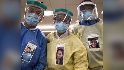 Healthcare workers wearing photos of themselves outside of their PPE to help put patients at ease.