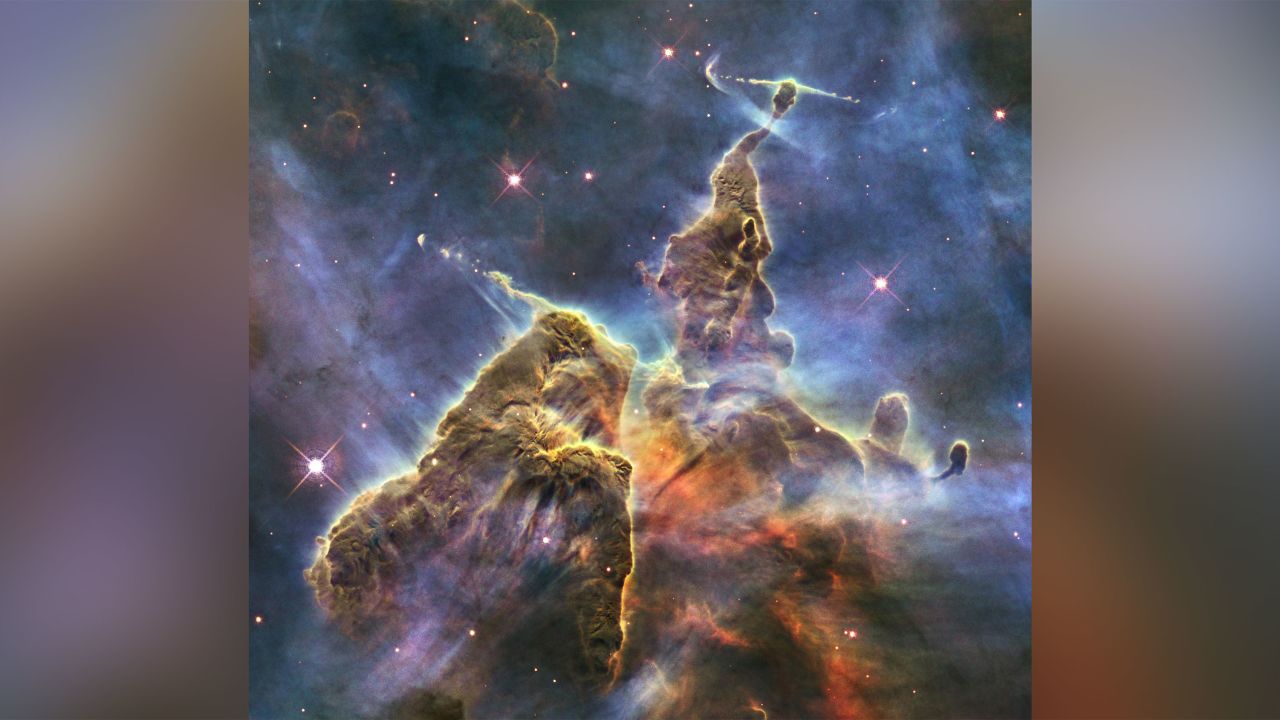 NASA's Hubble Space Telescope captures the chaotic activity atop a three-light-year-tall pillar of gas and dust that is being eaten away by the brilliant light from nearby bright stars in a tempestuous stellar nursery called the Carina Nebula