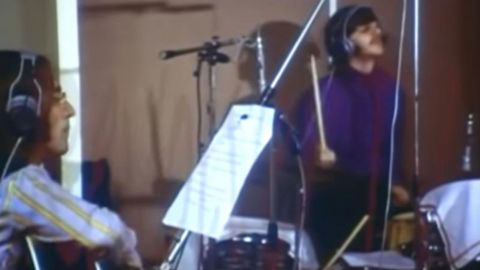 The Beatles recording "Hey Jude," featuring the lyrics.