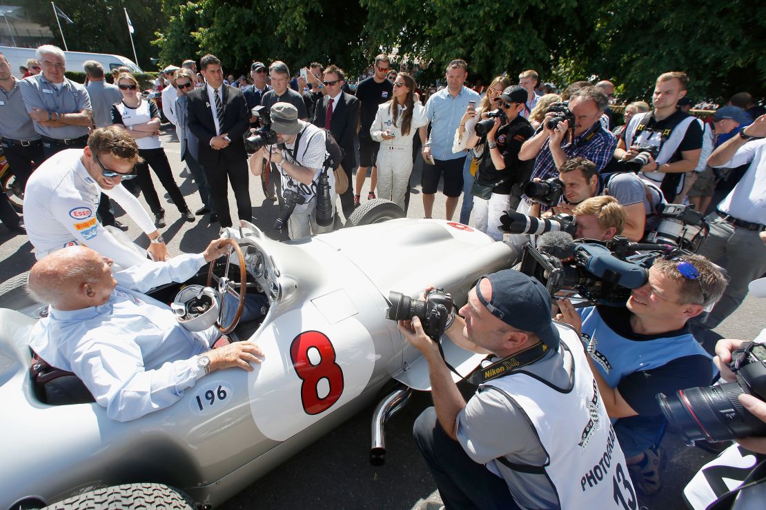 Stirling Moss and 2009 F1 world champion Jenson Button were the centre of media attention at the Goodwood Festival in 2015. 
