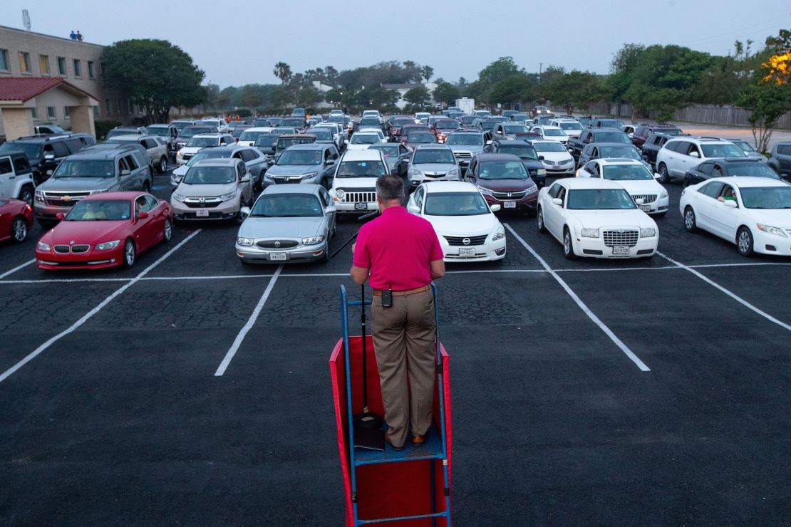 Pastor Brian Hill eads a drive-in Easter service in the parking lot of the First Baptist Church in Corpus Christi, Texas, on Sunday, April 12, 2020. Many churches have been holding outdoor services during the pandemic.