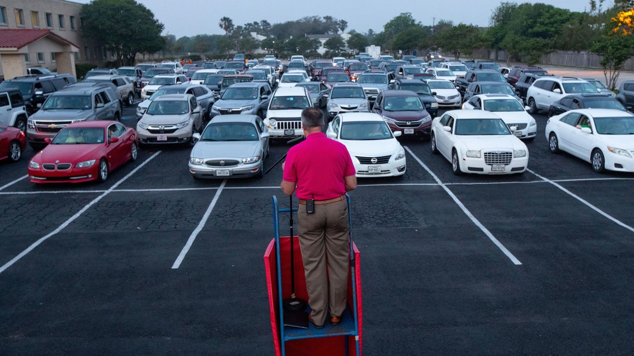 Pastor Brian Hill eads a drive-in Easter service in the parking lot of the First Baptist Church in Corpus Christi, Texas, on Sunday, April 12, 2020. Many churches have been holding outdoor services during the pandemic.