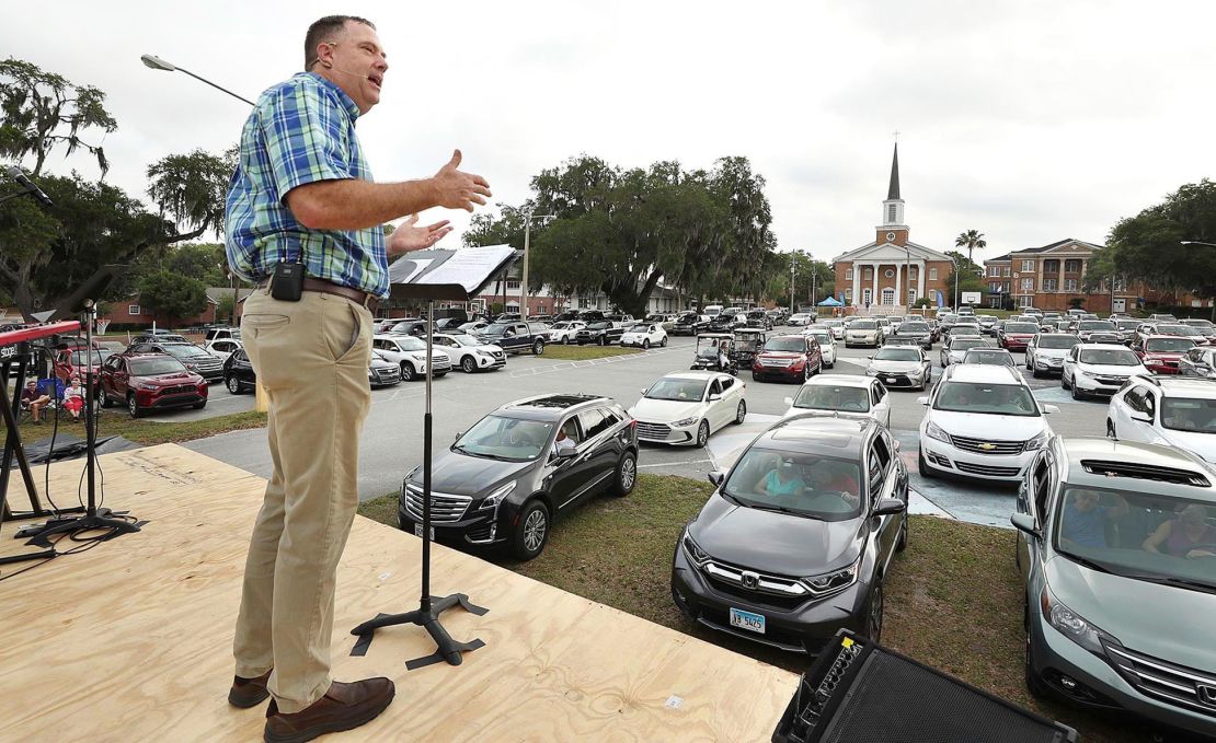 Pastor Cliff Lea preaches during a drive-in service at the First Baptist Church of Leesburg, Florida.