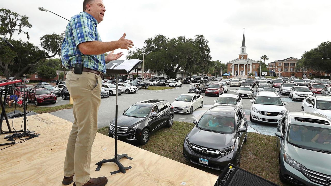 Pastor Cliff Lea preaches during a drive-in service at the First Baptist Church of Leesburg, Florida.