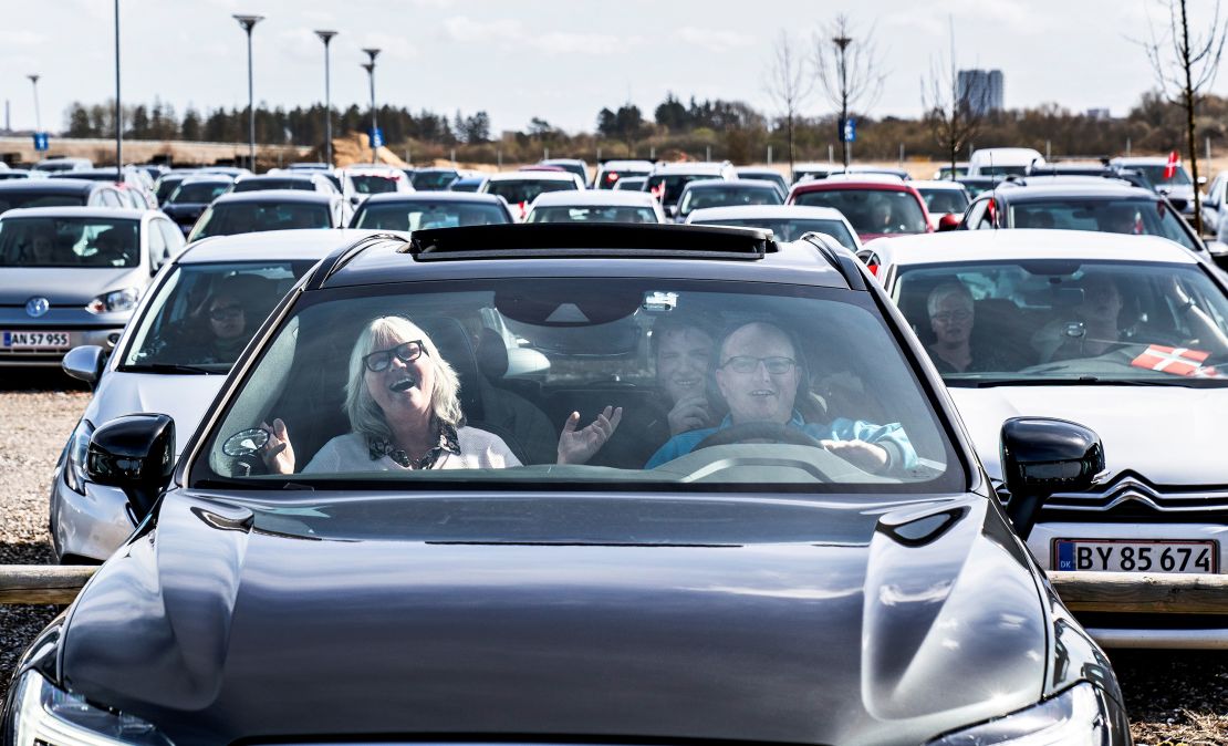 People sing hymns inside their cars during a drive-in Easter at the parking lot at Allborg Airport in Denmark on Sunday.